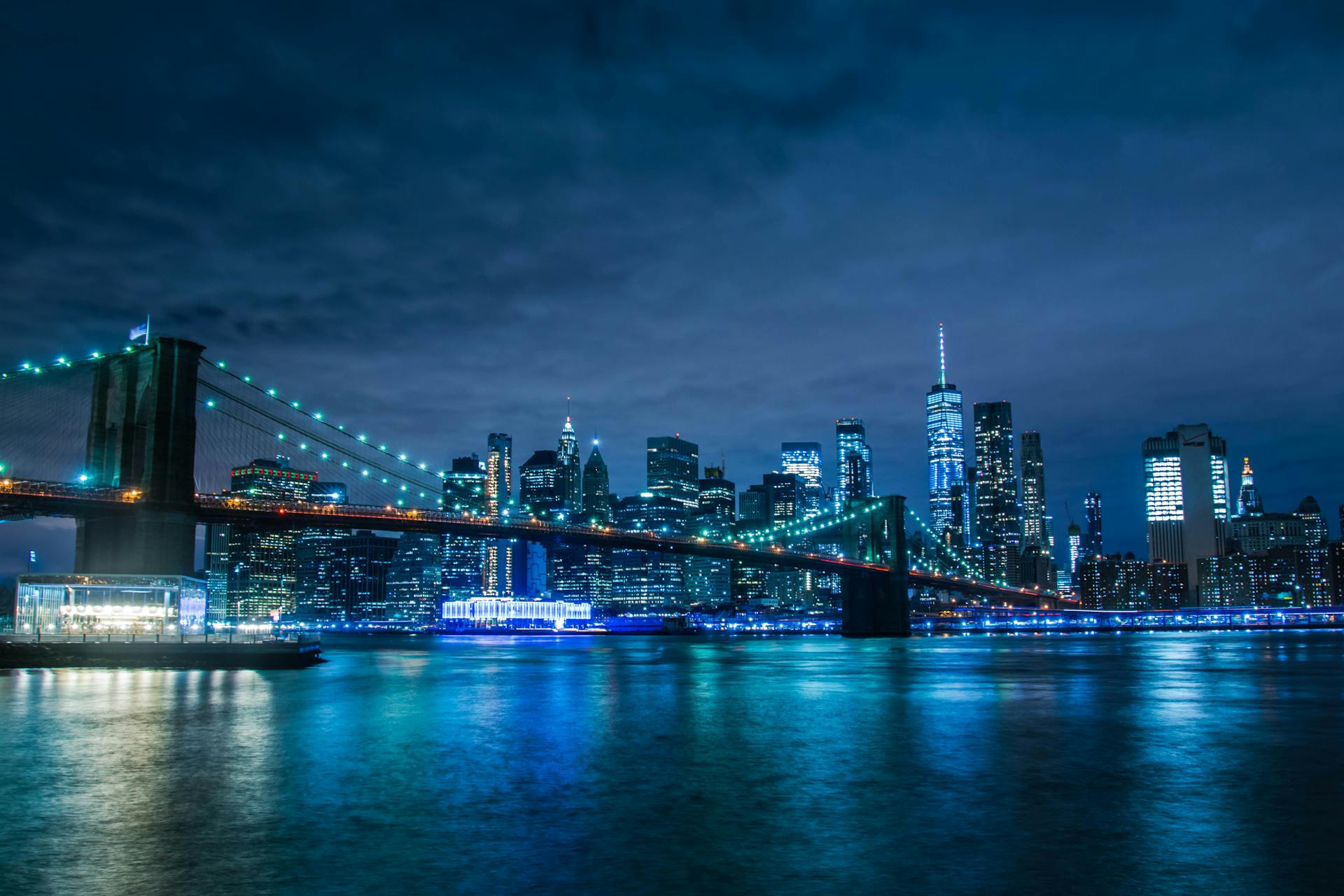 Manhattan skyline at blue hour with Brooklyn Bridge